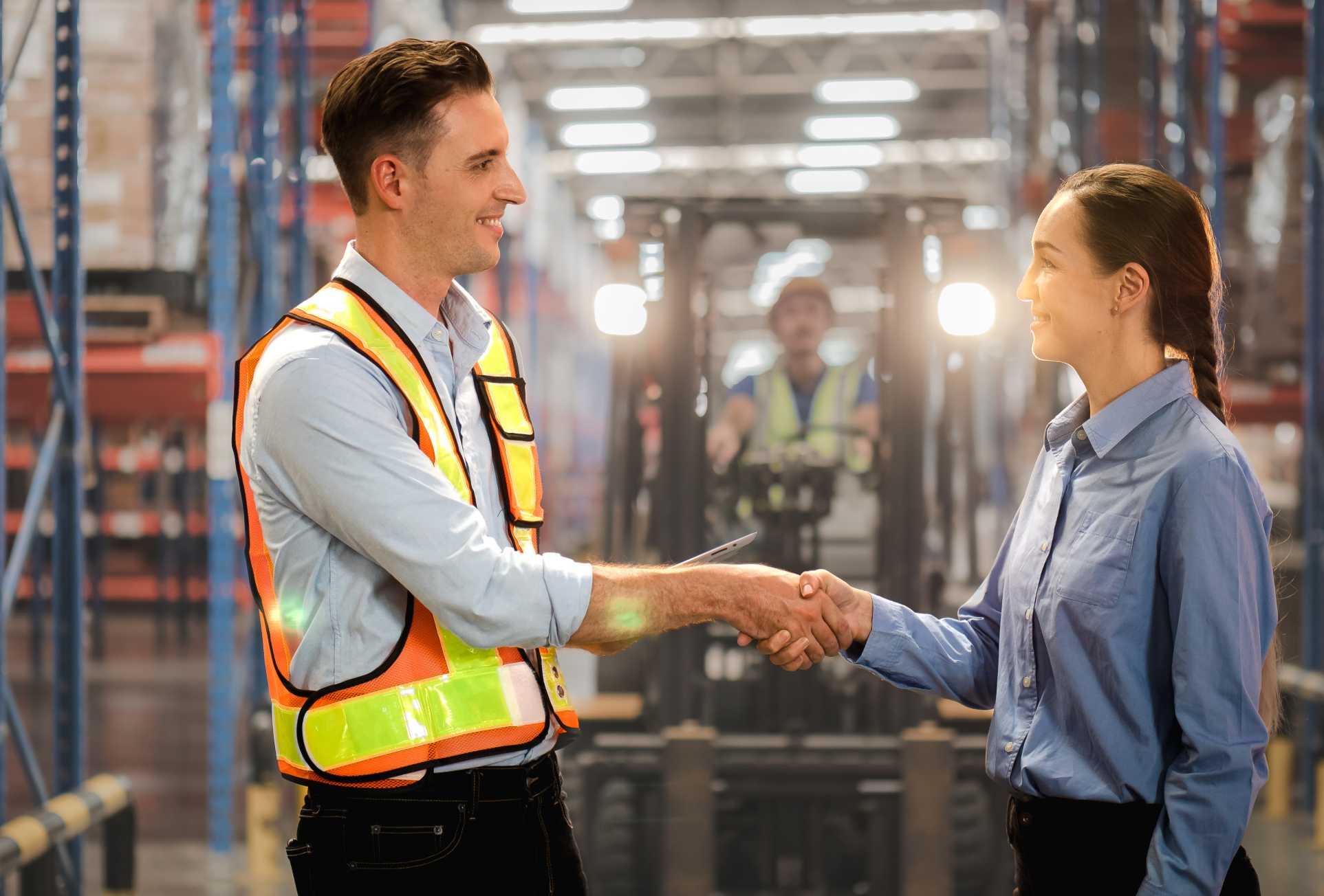 two people in a truckload liquidation warehouse